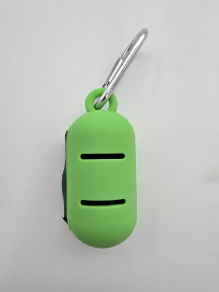 Green portable food grade silicone dog waste bag dispenser with clip comes with compostable and recycled rolls, shows leash slots
