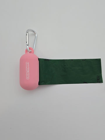 Pink portable food grade silicone dog waste bag dispenser with clip comes with compostable and recycled rolls, shows bag pulled out - thumbnail