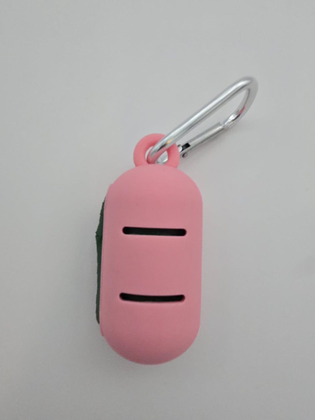 Pink portable food grade silicone dog waste bag dispenser with clip comes with compostable and recycled rolls, shows leash slots