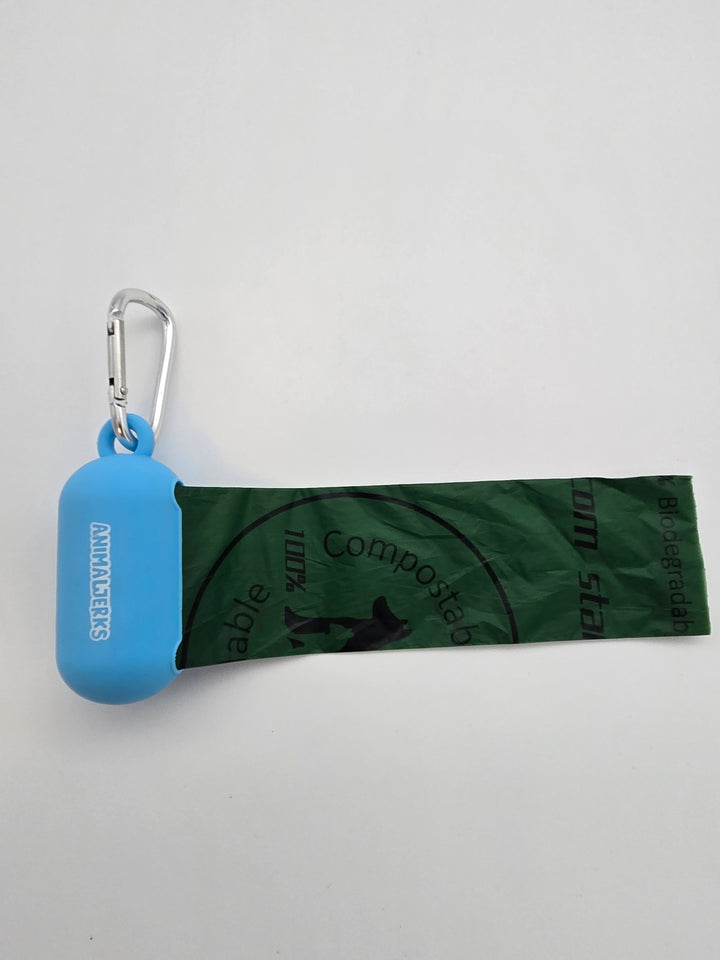 Blue portable food grade silicone dog waste bag dispenser with clip comes with compostable and recycled rolls, shows bag pulled out