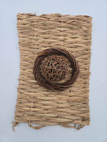 Woven grass matt 11 inches x 15 inches with a willow 6 inch halo sitting on the matt and a willow 2.5 inch ball inside the halo - thumbnail