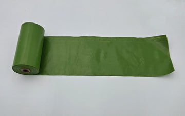 Recycled plastic dog poop bags green roll with unrolled bag showing 9x13 size - thumbnail
