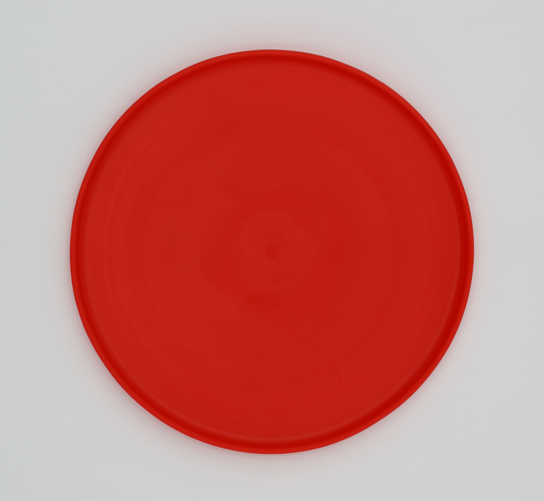 Red food grade silicone flying disc for dogs soft flexible frisbee dishwasher safe durable, bottom view