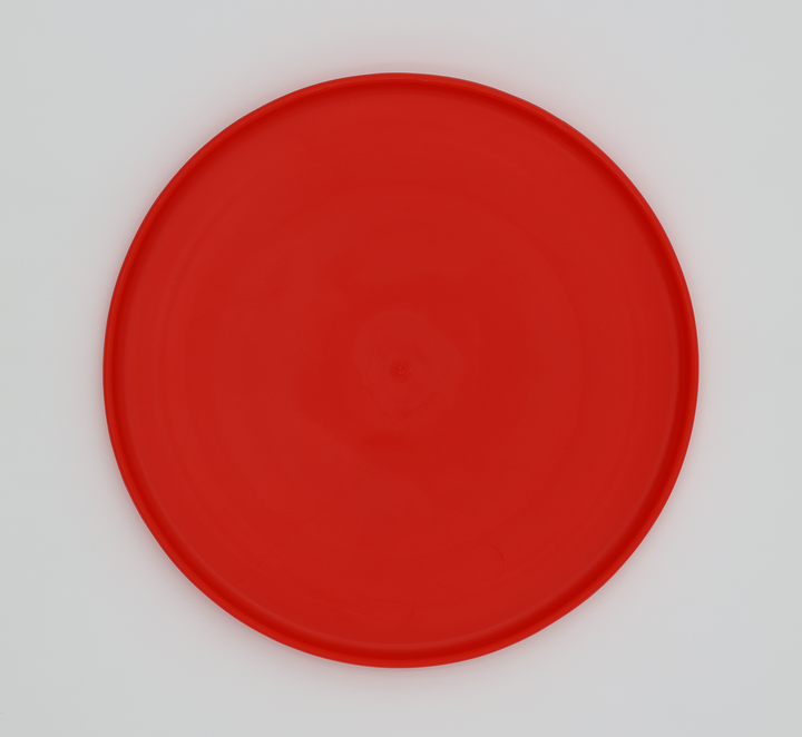 Red food grade silicone flying disc for dogs soft flexible frisbee dishwasher safe durable, bottom view