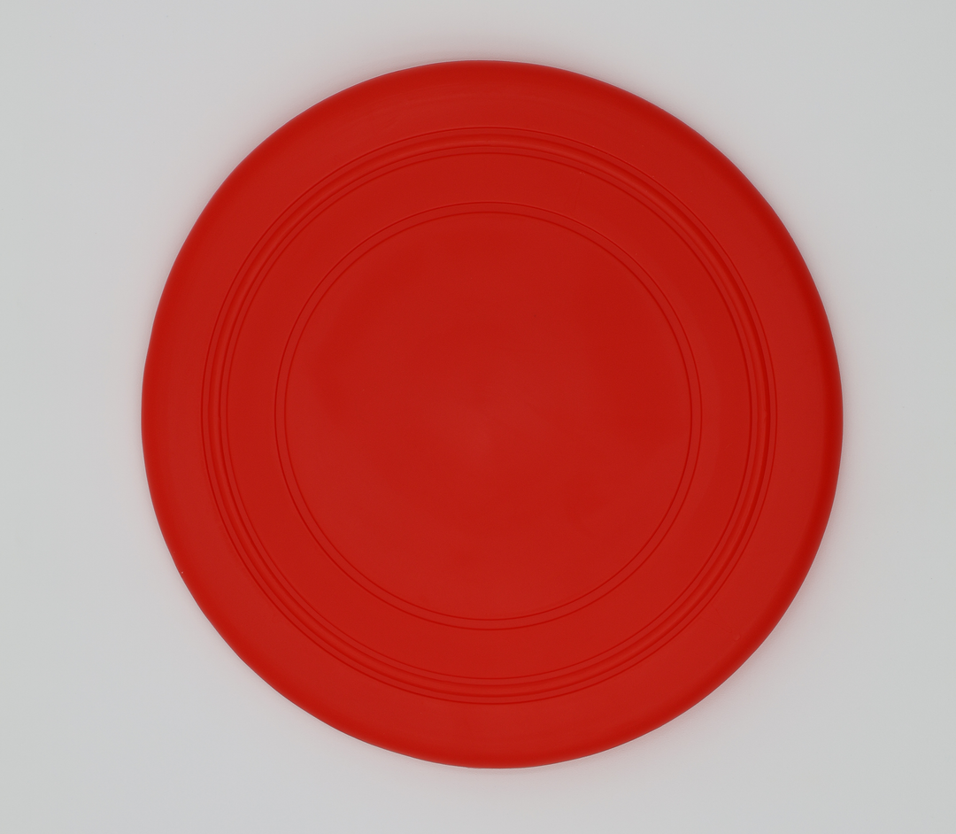 Red food grade silicone flying disc for dogs soft flexible frisbee dishwasher safe durable, top view
