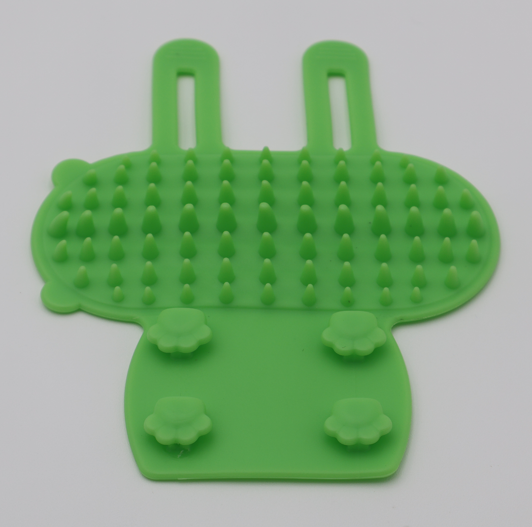 Green silicone cat grooming scratcher attaches to furniture legs two sizes