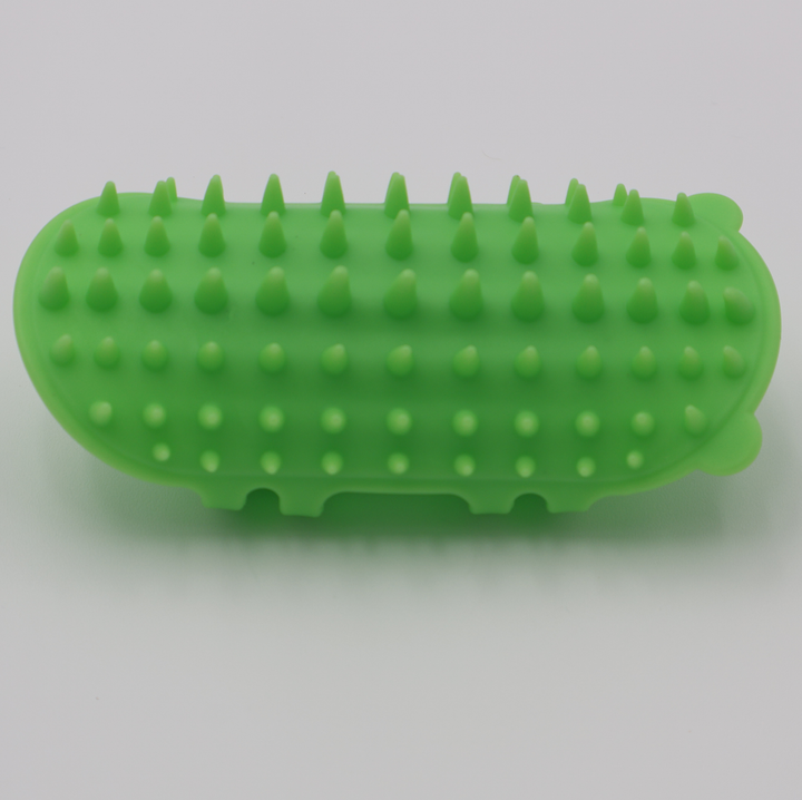 Green silicone cat grooming scratcher, showing what it would look like attached to a table leg.