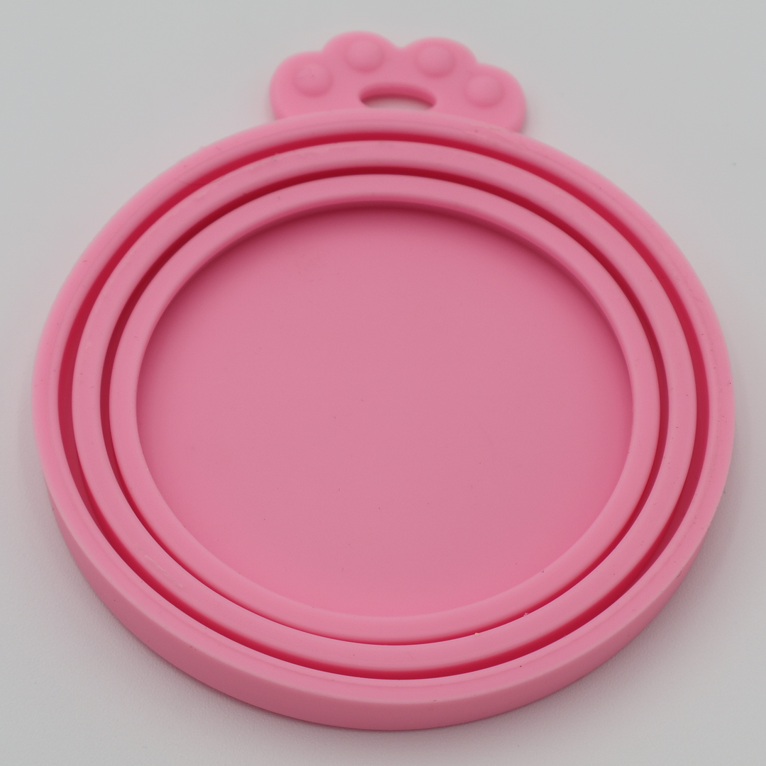 Pink food-grade silicone lids for pet food cans airtight flexible universal fit, underneath view
