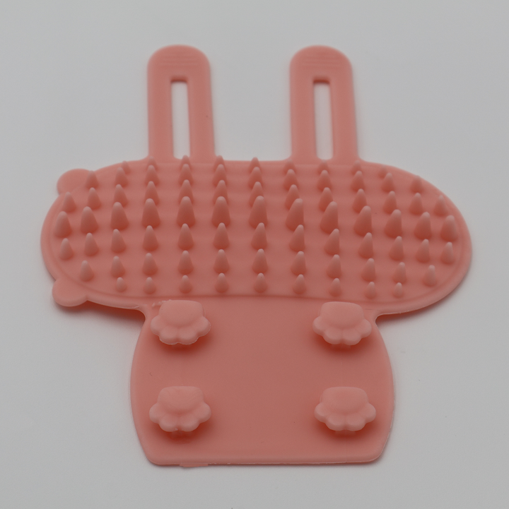 Pink silicone cat grooming scratcher attaches to furniture legs two sizes