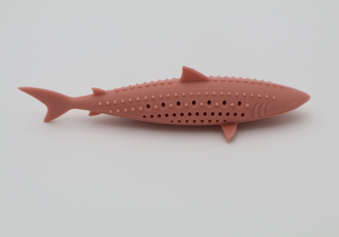 Coral pink durable food grade silicone shark toy for cats hollow center for catnip dishwasher safe, side view