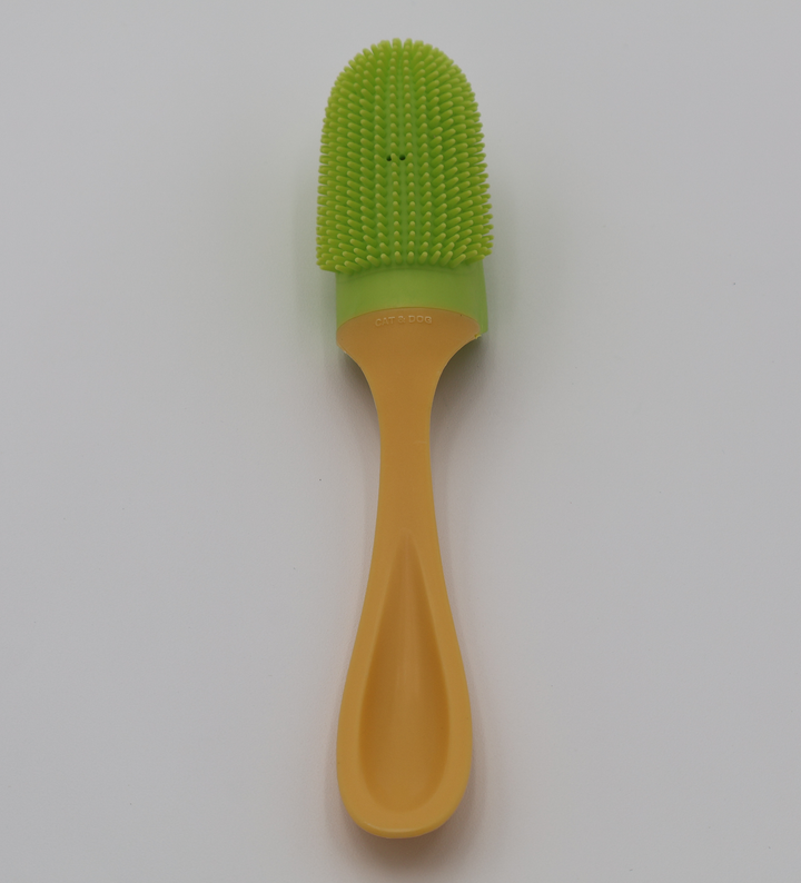 Pet toothbrush with  lime green silicone bristle head and ergonomic yellow plastic handle 